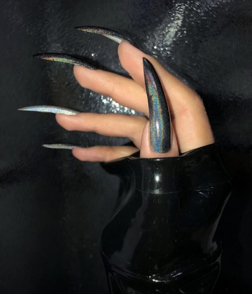 Delhi BDSM Mistress Anu hand with long stiletto nails and dark aesthetic