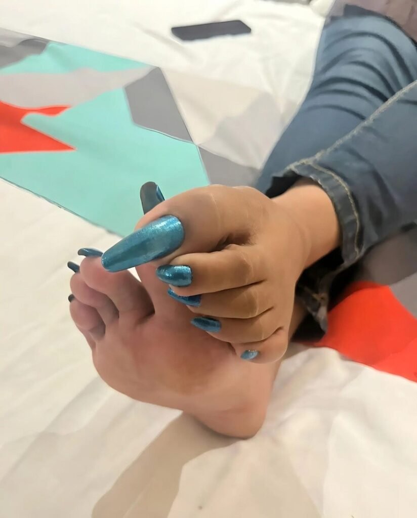 Delhi BDSM Mistress Anu foot fetish image with long nails and soft skin