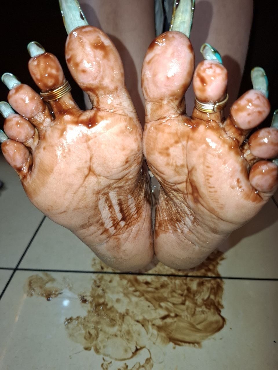 Atlanta BDSM Mistress Anu feet with long painted toenails