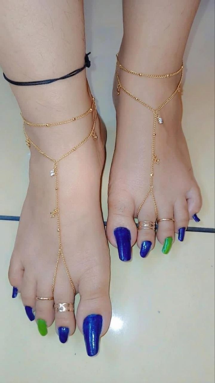 Feet with painted toenails for the Geneva BDSM Mistress page