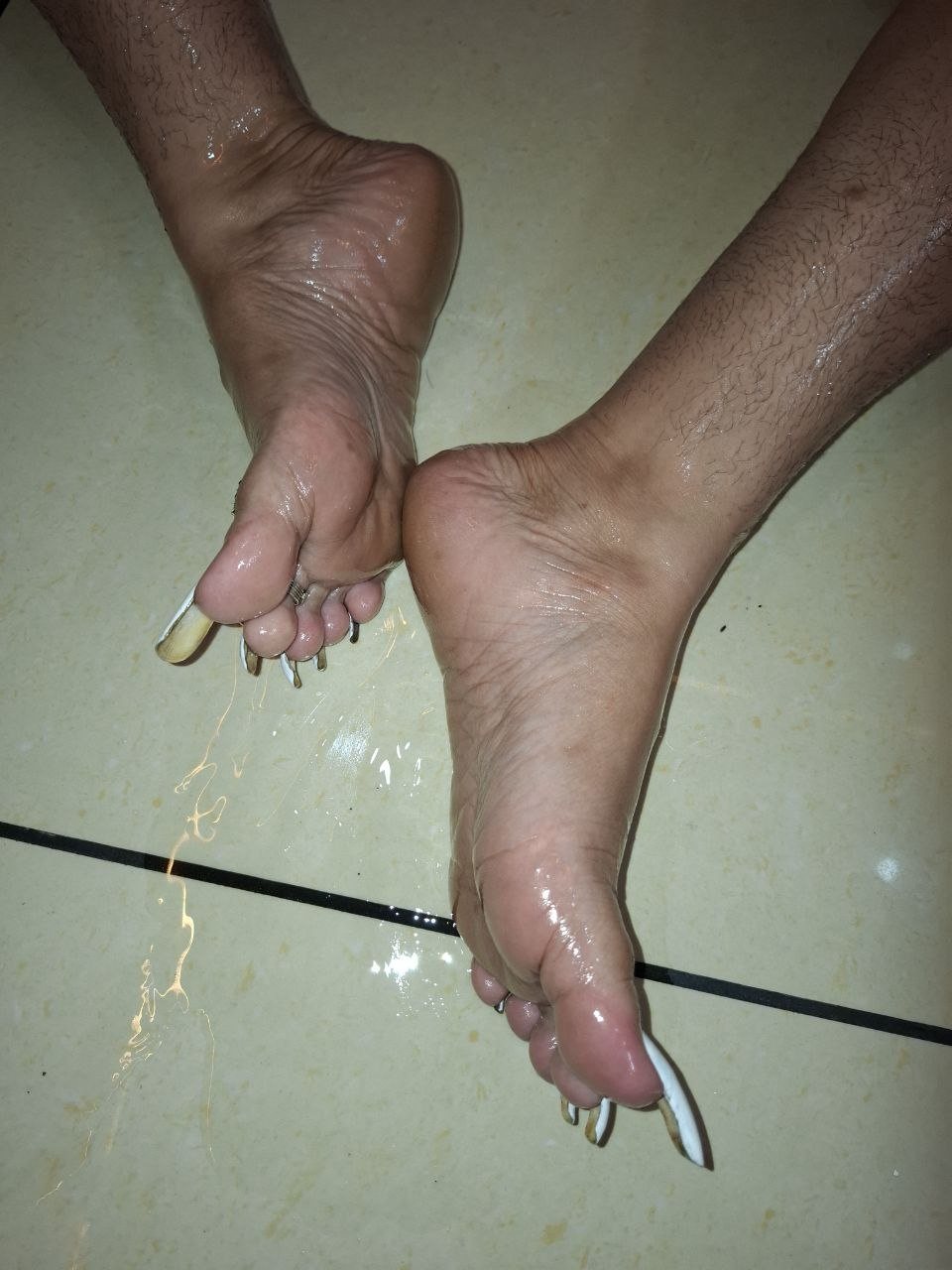 Manchester BDSM Mistress Anu feet with long painted toenails