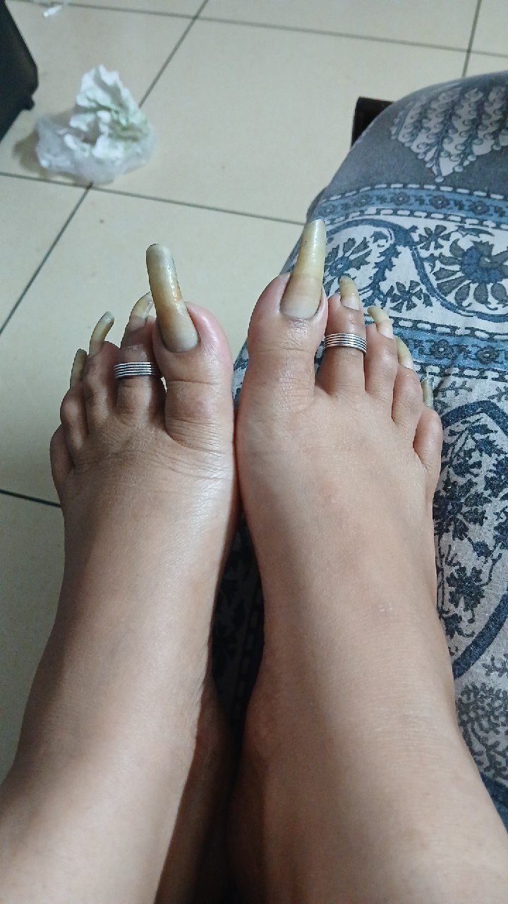 Feet with painted toenails for the Mussoorie BDSM Mistress page