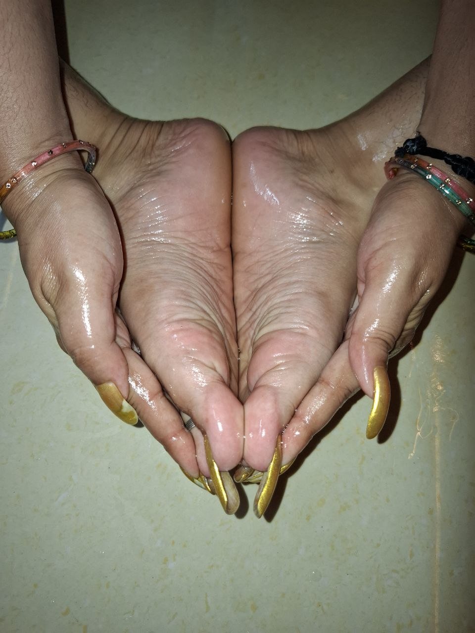 Odense BDSM Mistress Anu feet with long painted toenails
