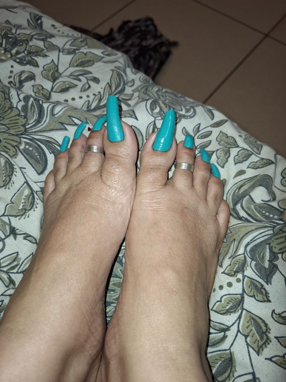 Ottawa BDSM Mistress Anu feet with long painted toenails