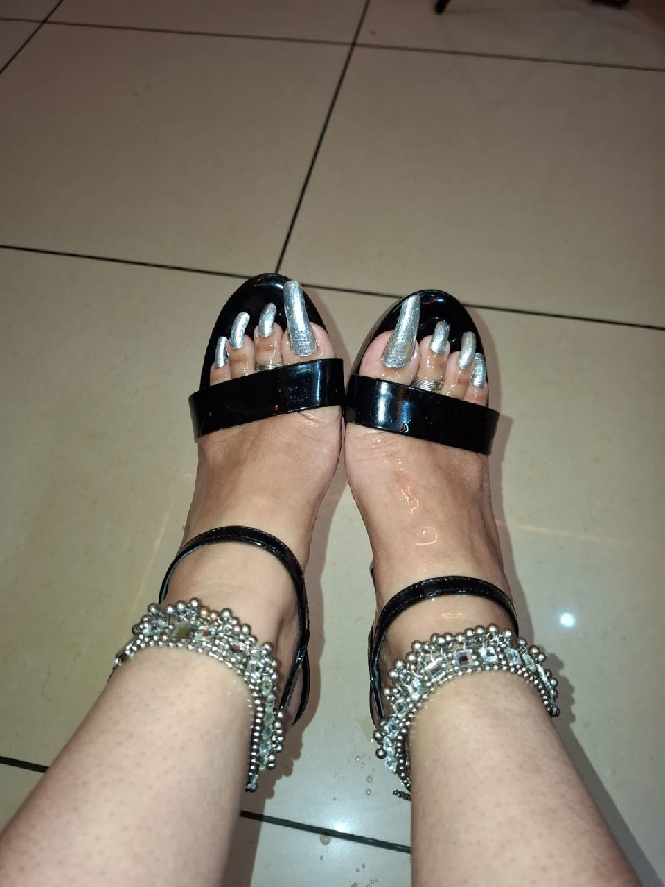 Close-up of feet with painted toenails for the Srinagar BDSM Mistress page