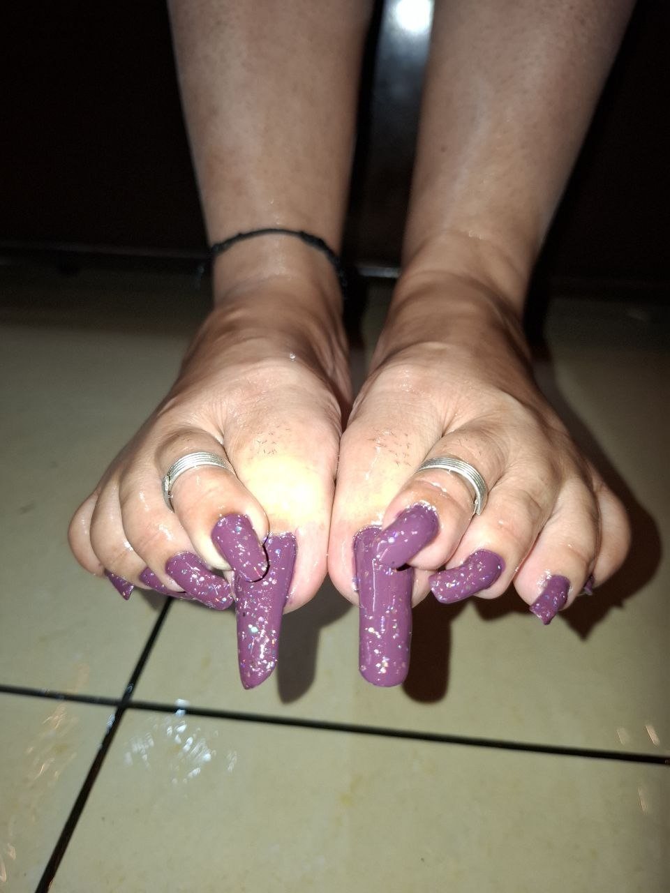 The Hague BDSM Mistress Anu feet with long painted toenails