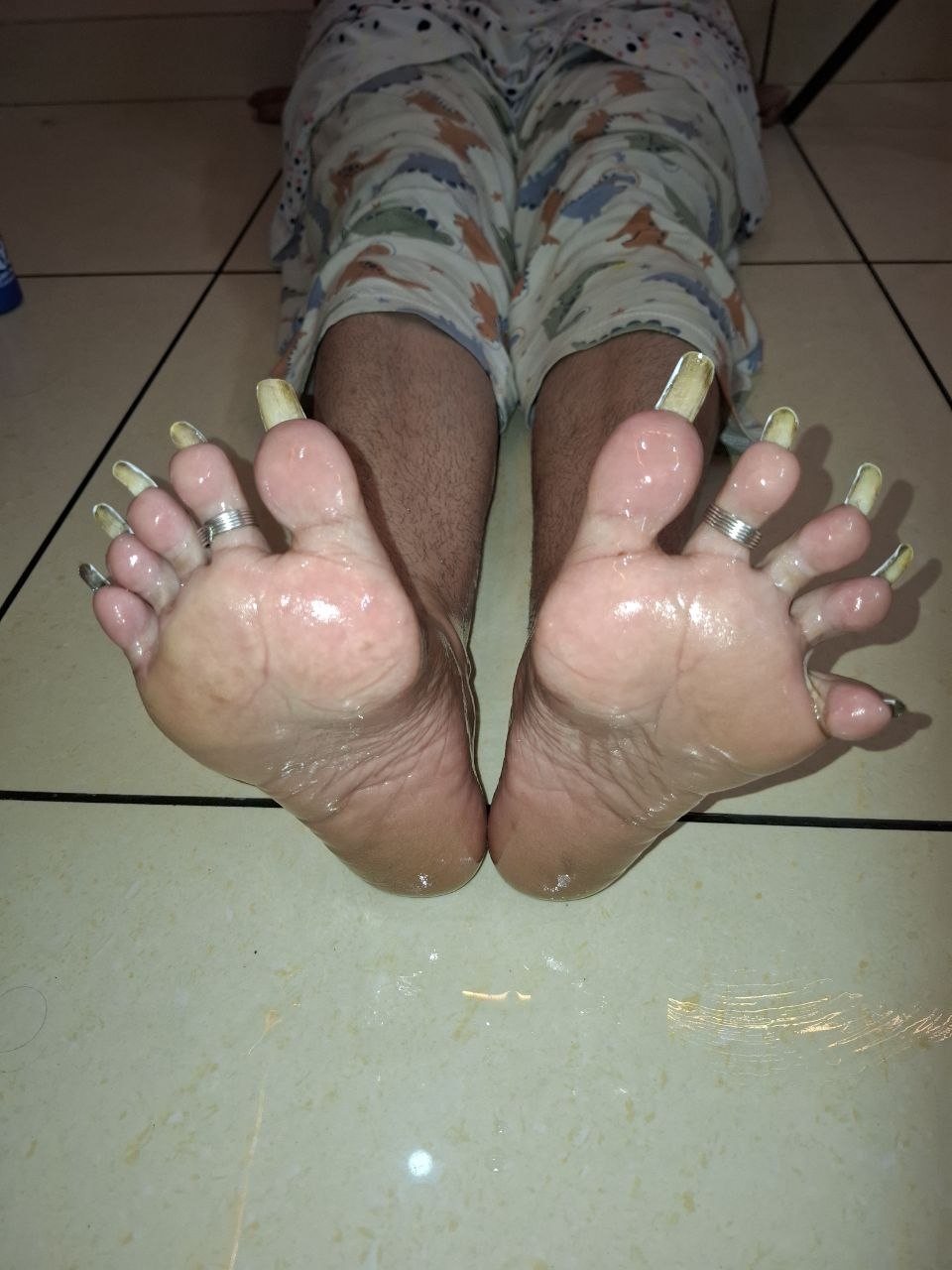 Utrecht BDSM Mistress Anu feet with long painted toenails